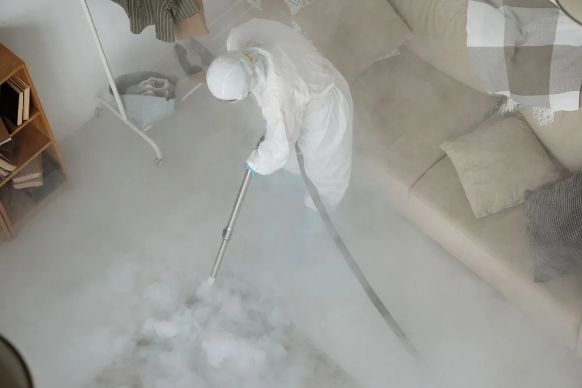 Biohazard cleanup technician in protective equipment, Waldoboro, ME